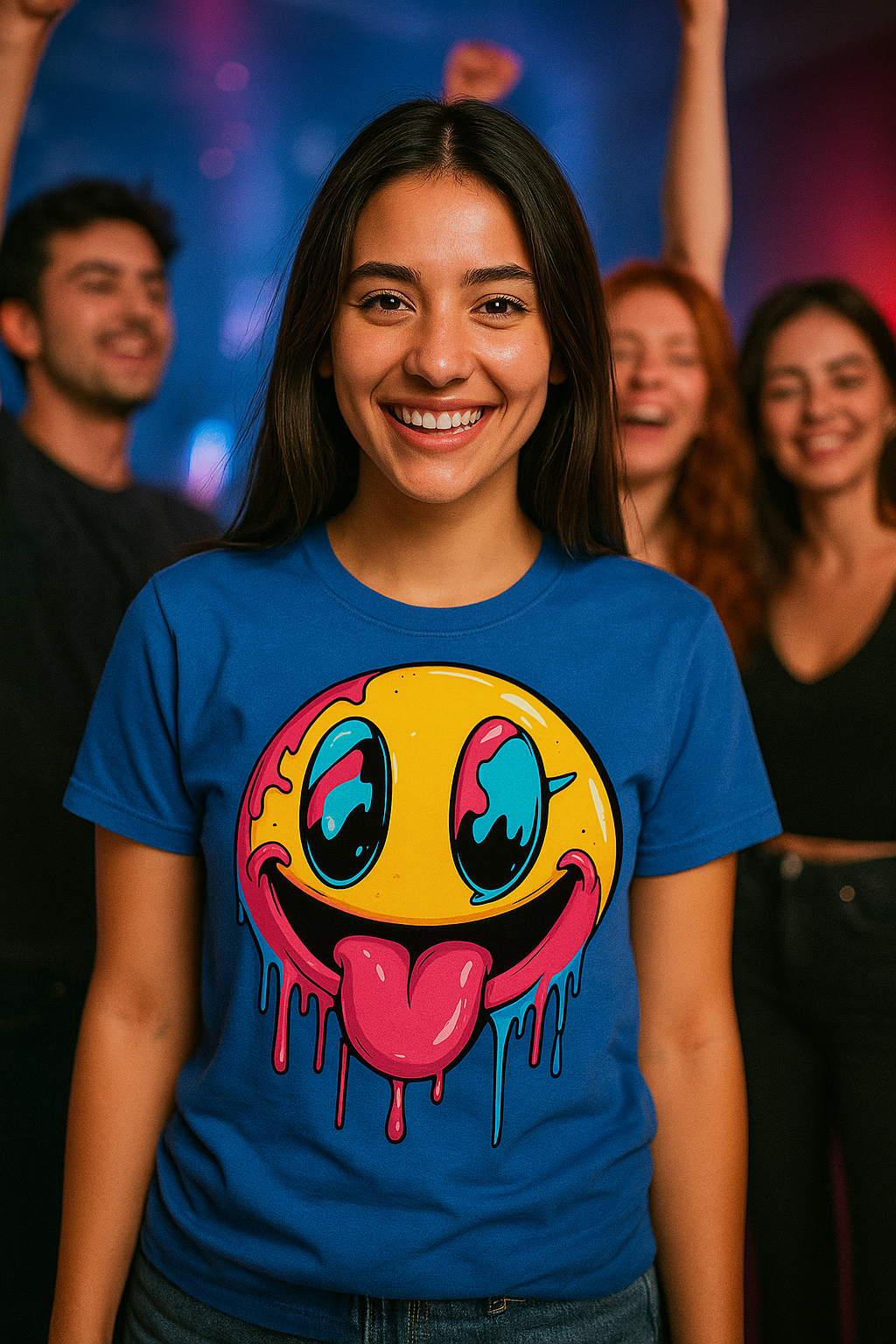 Person wearing a blue t-shirt with a colorful smiley face design, standing in front of a group of people.