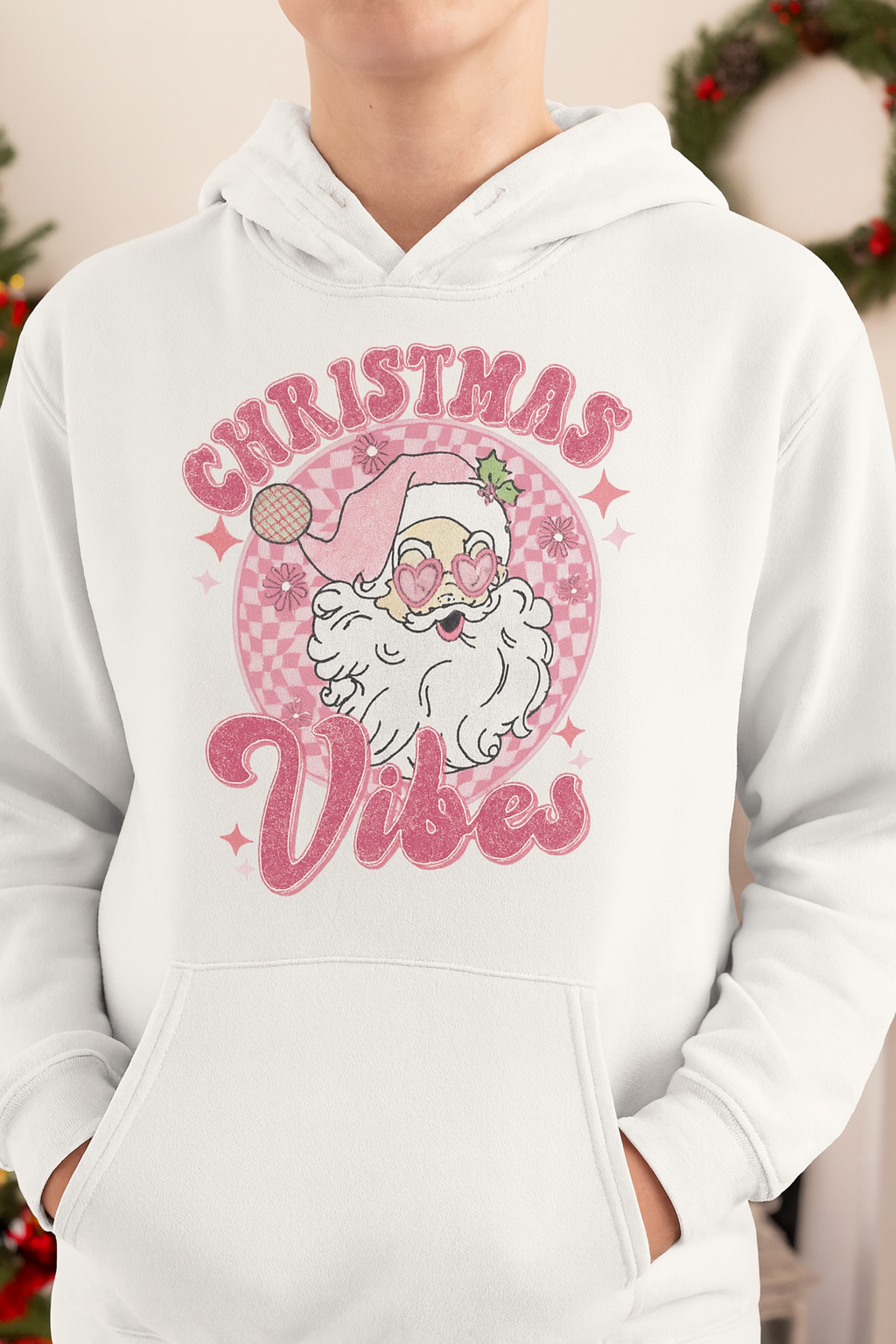 White hoodie with Christmas-themed design featuring Santa Claus and 'Christmas Vibes' text.