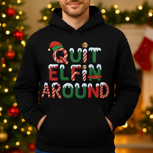 Person wearing a black hoodie with Christmas-themed text in a festive setting.