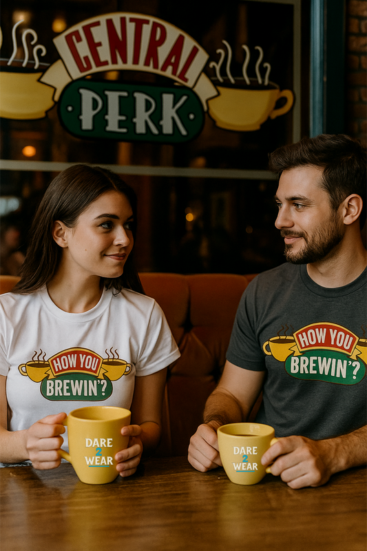 White and Grey t-shirt with “How You Brewin’?” text and yellow coffee cups design – perfect for coffee drinkers and baristas
